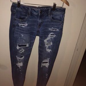 Ripped low rise jeggings.